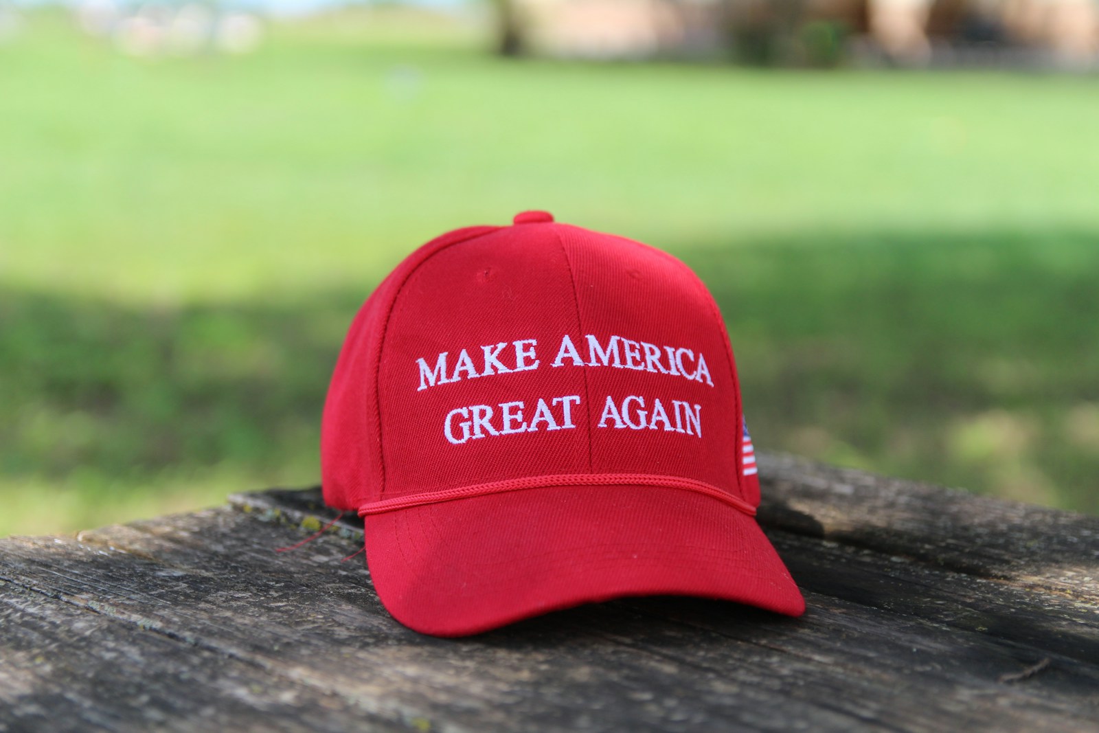 a red hat that says make america great again, donald trump